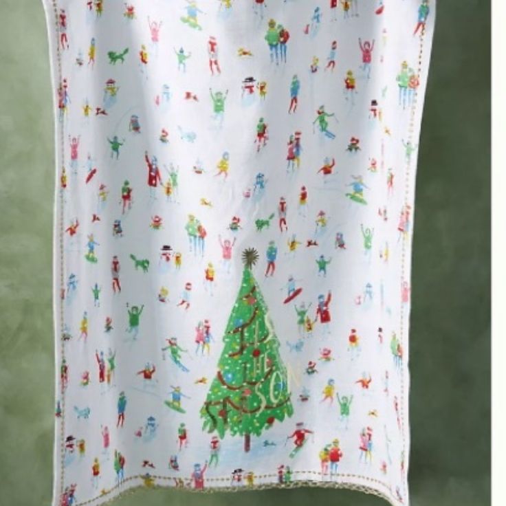 a christmas tree is hanging on the clothes line