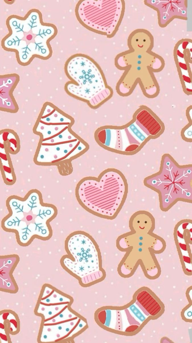 gingerbread cookies and candy canes on a pink background