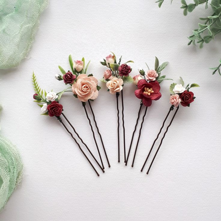 This set burgundy flower hair pins wedding , of artificial flowers This a beautiful and delicate hair accessory for brides and a nice gift to the bridesmaids   On the wedding day, every bride wants to look fantastic. This flower hair piece , will be a magical addition to your look on your happiest day.  This will emphasize the ease of your image.  The comb is very conveniently attached to the hair and fits in with any hairstyle.  -Material- artificial pearl and artificial greenery  -Colors-  burgundy, rust, green, white - Unique handmade.  Wedding - is one of the most important events in the life of any girl I am happy to try to make the most beautiful decoration for you, to make you feel the most beautiful bride. You deserve the best! Flower Hair Pins Wedding, Floral Hair Piece, Flower Hair Piece, Hair Pins Wedding, Flower Hair Pins, Floral Hair Pieces, Flower Hair Pieces, Floral Hair Pins, Artificial Greenery