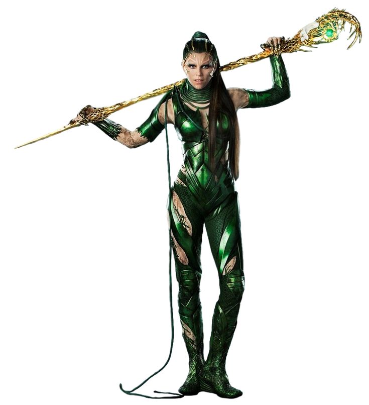 a woman dressed in green and gold holding a spear with two arrows on her shoulder