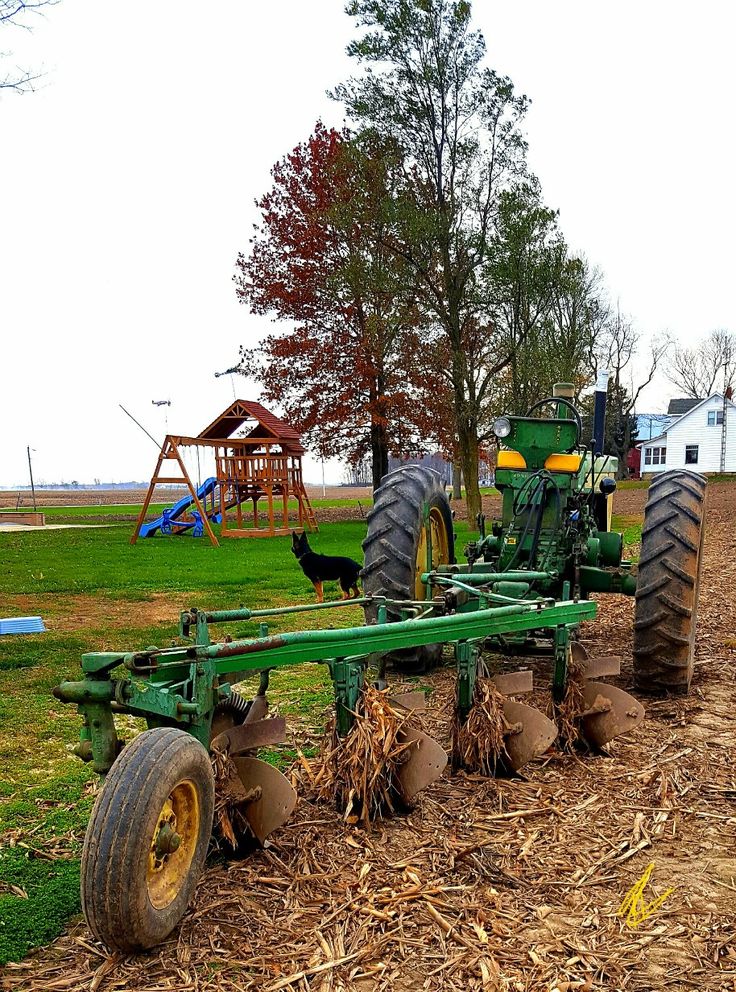 a tractor is parked in the middle of a field