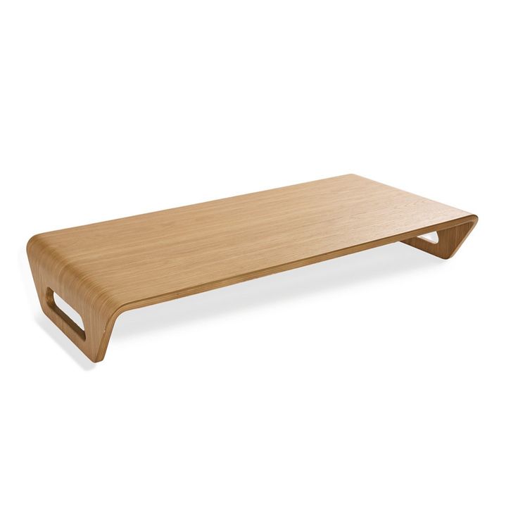 a wooden shelf sitting on top of a white wall in front of a white background