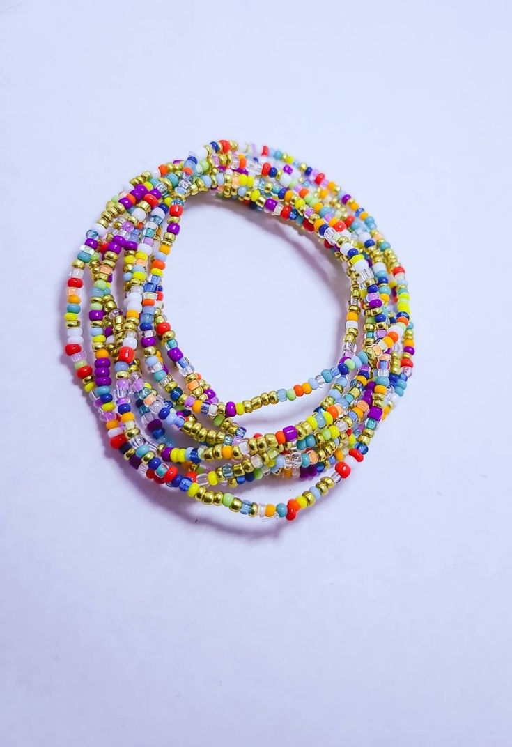 This listing is for ten stackable confetti seed bead bracelets. They have hints of gold and rainbow beads. They are stretch and strung on strong elastic. Great boho jewelry that would be a good gift for a sister, friendship bracelets, mom, ect. If ypu do not see your size send me  a note. Cheap Playful Rainbow Stretch Bracelet, Multicolor Friendship Bracelets With Spacer Beads As Gift, Multi-strand Beaded Bracelets With Spacer Beads As Gift, Trendy Gold Friendship Bracelets With Colorful Beads, Adjustable Multicolor Tiny Beads Jewelry, Multicolor Heishi Beads Friendship Bracelet Gift, Multicolor Stackable Stretch Bracelet With Round Beads, Bohemian Gold Beaded Stretch Bracelet, Trendy Heishi Beads Bracelet For Gift