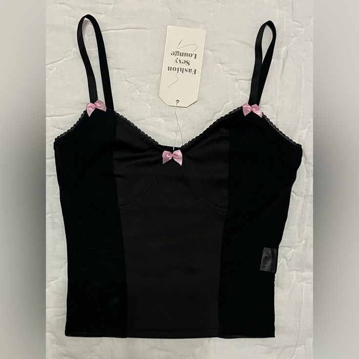 Unbranded Mesh Bustier Corset Top Color: Black With Pink Bows Size: S Please See Photos For Measurements And Material. New With Tags!! Questions? Please Leave A Comment Below! I Love Offers! Don’t Be Shy! Make An Offer! New To Poshmark? Want $10 Off Your First Poshmark Purchase? Join Me Now On My Favorite App By Creating A New Account!! For A Limited Time, Use My Code Freedomfairy To Save $10 On Your First Purchase: Https:// Posh.Mk/Poibgdktmgb $10 Off Your First Poshmark Purchase! I Love Offers Trendy Black Corset With Built-in Bra, Black Crop Top Corset With Built-in Bra, Fitted Cotton Camisole For Party, Y2k Black Strappy Tank Top, Y2k Black Cami Crop Top, Fitted Crop Top Bra With Removable Pads, Black Y2k Top With Built-in Bra, Black Y2k Crop Top With Built-in Bra, Y2k Black Crop Top With Built-in Bra