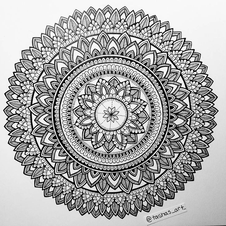 a black and white drawing of a circular object with intricate designs on it's surface