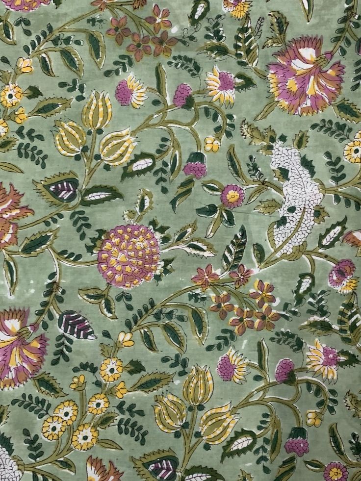 a green background with flowers and leaves on the side, it looks like an old wallpaper