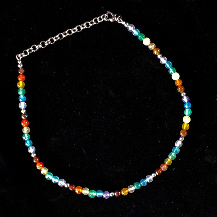 Indulge in the beauty of diversity with this exquisite Rainbow pattern Agate gemstone necklace. Let it adorn your neck with a vibrant array of colors, capturing the essence of Pride. metal is silver plated alloy 15" long, 3.5" chain, 18.5" total length We do our best to choose each stone carefully and purposefully for every piece.. However there might be slight differences in color size shape and clarity which makes each item unique and one of a kind. Each piece of jewelry will come in a colored Adjustable Rainbow Polished Beads Necklace, Adjustable Rainbow Necklaces With Polished Beads, Handmade Multi-tone Jewelry Gift, Multicolor Nickel-free Spiritual Beaded Necklace, Multicolor Beaded Agate Necklaces, Multicolor Spiritual Beaded Necklaces Nickel Free, Nickel-free Multicolor Spiritual Beaded Necklace, Spiritual Multicolor Nickel-free Beaded Necklace, Silver Agate Round Beads Necklace