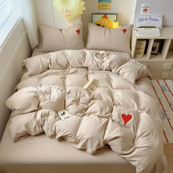 an unmade bed with many pillows on it