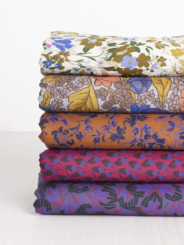 four different fabrics stacked on top of each other