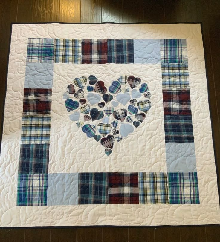 a heart made out of small hearts on a quilt