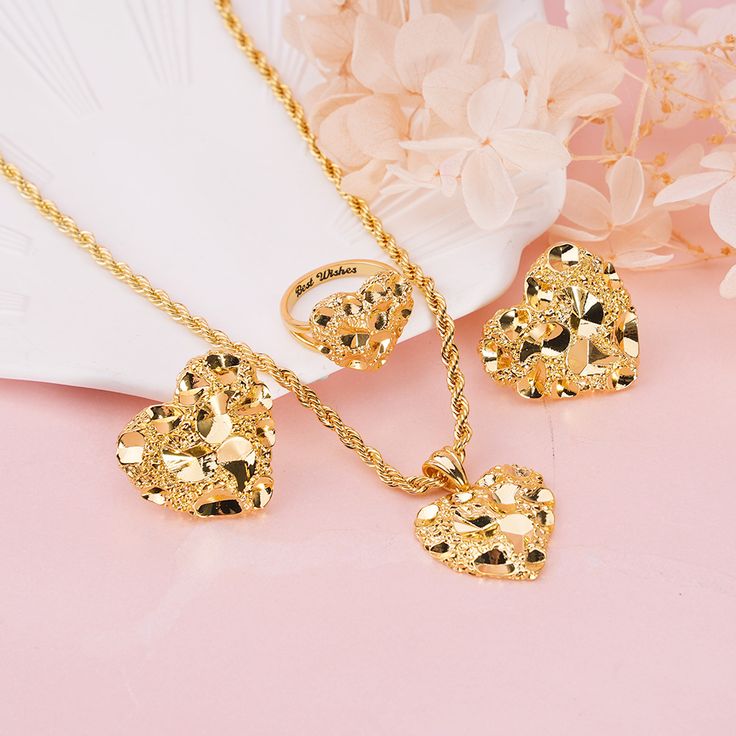 Material: Copper. Color: Gold. Necklcae Chain Length: 14",16",18",20",22". Ring Size: 5.0, 5.5, 6.0, 6.5, 7.0, 7.5, 8.0, 8.5, 9.0, 9.5, 10. Process: Gold plated. Recipient: Woman, Mom, Wife, Girl Friend, Children, Family. Product Type: Personalized Jewelry. Gift Type: Set. Jewelry Type: Name Ring, Necklace,Stud Earrings. Brand: Silviax Jewelry. Item: 2023S0104.  Discover elegance and sentiment with nugget love heart Set, featuring a personalized name ring,necklace, and stud earrings. This exquis Gold Nugget Rings, Valentine's Day Heart Cut Jewelry Sets, Gold Plated Jewelry For Valentine's Day Anniversary, Heart-shaped Jewelry Sets For Wedding And Mother's Day, Tarnish Resistant Jewelry For Valentine's Day Gift, Valentine's Day Gift Tarnish Resistant Jewelry, Valentine’s Day Gift Tarnish-resistant Jewelry, Valentine's Day Anniversary Gift Gold Plated Jewelry, Gold Plated Heart Cut Jewelry For Valentine's Day