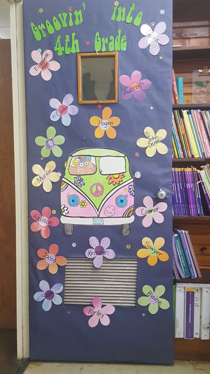 a door decorated to look like a bus with flowers on the front and side,