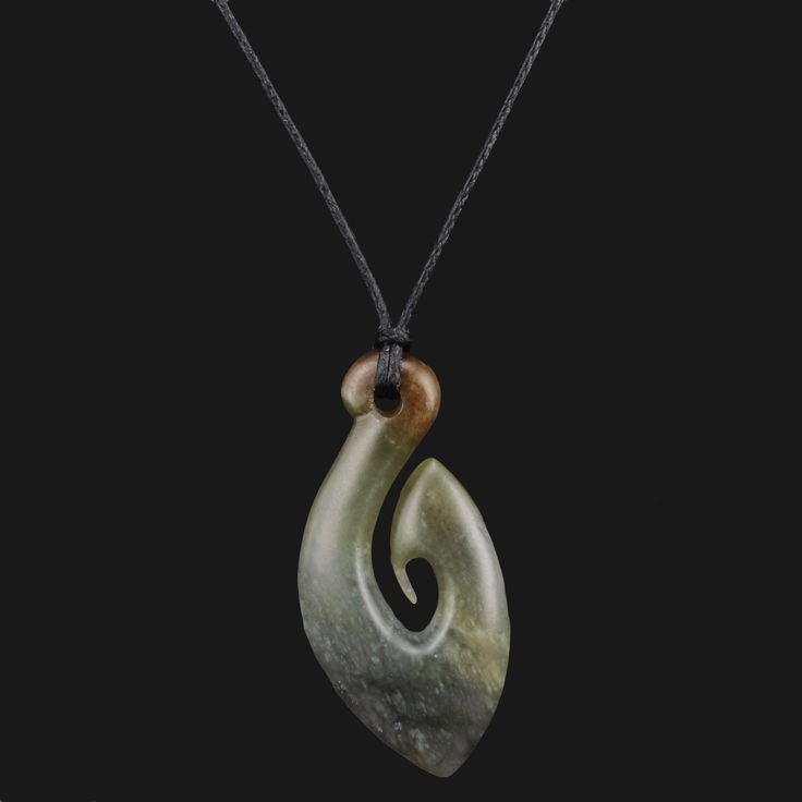 This New Zealand-style pendant necklace is hand-carved from gray flower jade stone and features a unique Maori Hei Matau / fishhook carving. Its small size and flower jade stone make it a perfect choice for subtle, yet eye-catching jewelry. Approximate size: 48mm(1.89″) by 22mm(0.87″) Carved From Chinese Jade Adjustable Necklace Wax Cord Comes With Jewelry Box, Polishing Cleaning Cloth. Item Pictured Is The One You'll Receive Hei Matau (Hook) - Meaning The Hei Matau is believed to bring luck, he Flower Jade, Maori Designs, Gray Flower, Chinese Jade, Grey Flowers, Jewelry For Men, Necklace Unique, Jade Stone, Adjustable Necklace