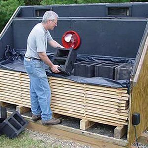 a man standing in the back of a truck