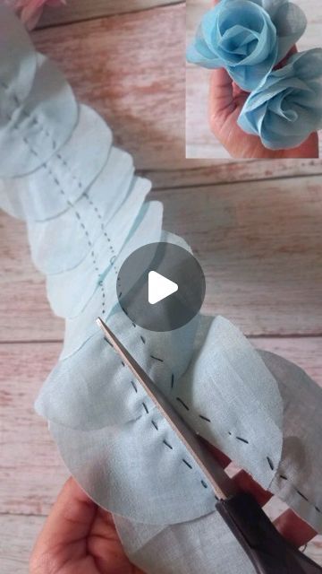 someone is cutting fabric with scissors on a wooden table, and the video shows how to sew