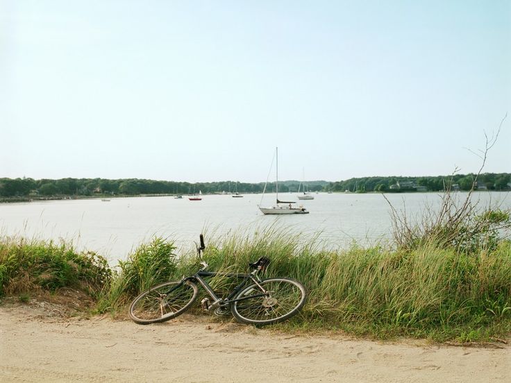 there is a bike that is parked by the water