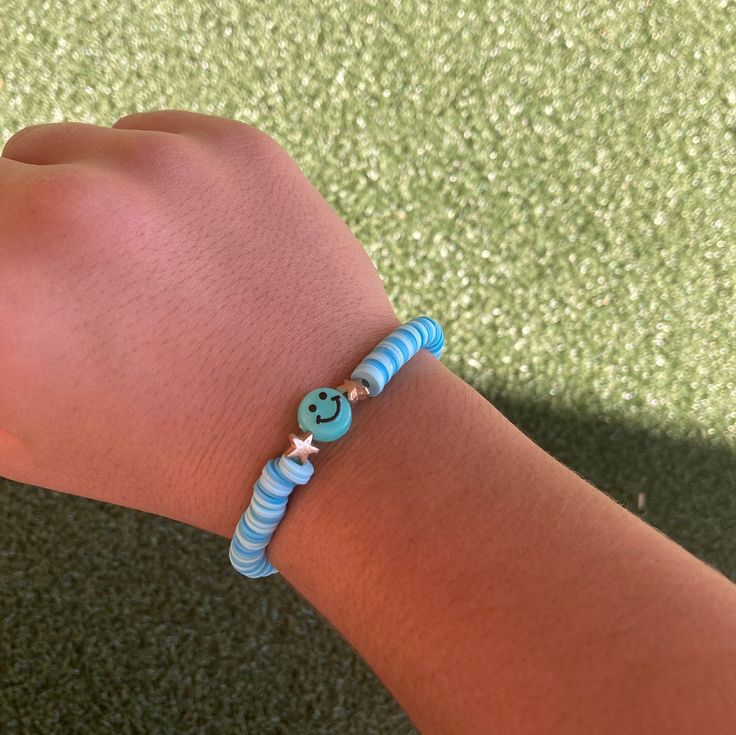 Dark and light blue smiley bracelet. Cute Blue Beaded Friendship Bracelets, Trendy Turquoise Bracelets, Fun Blue Bracelets For Gifts, Fun Blue Beaded Bracelets For Gifts, Trendy Evil Eye Bracelet For Friendship, Fun Blue Beaded Bracelets, Playful Blue Beaded Bracelets As Gift, Playful Blue Beaded Bracelets For Gift, Playful Blue Beaded Bracelets For Gifts