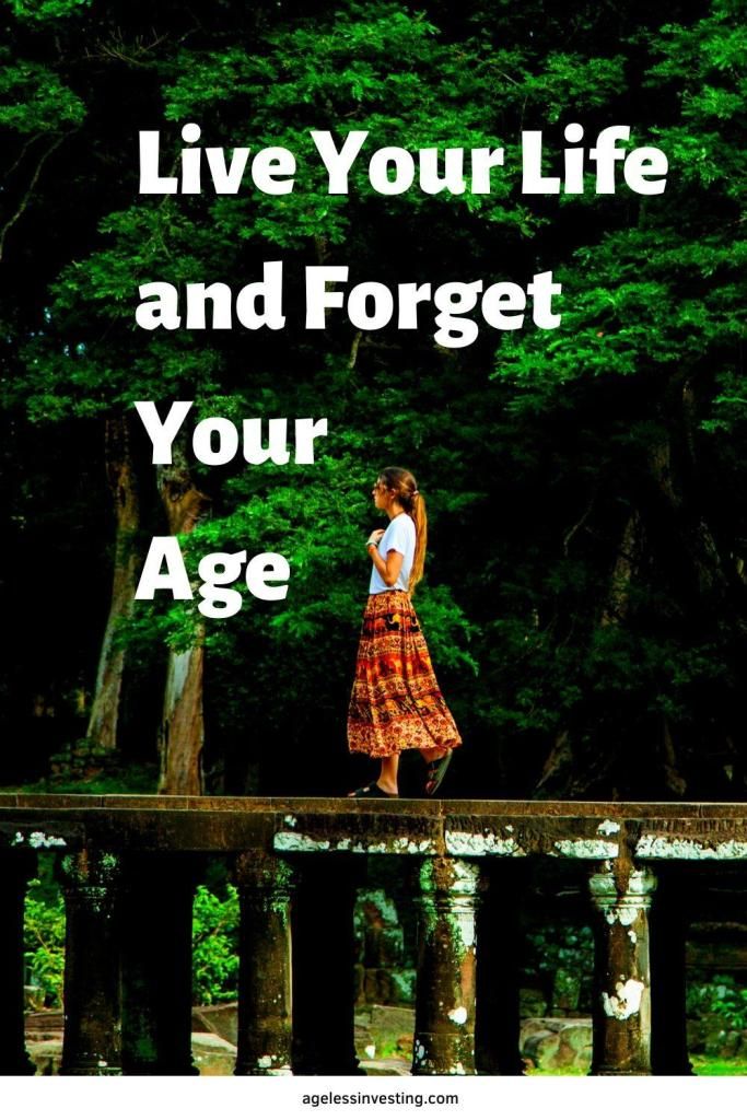 a woman standing on top of a wooden bridge with the words live your life and forget your age