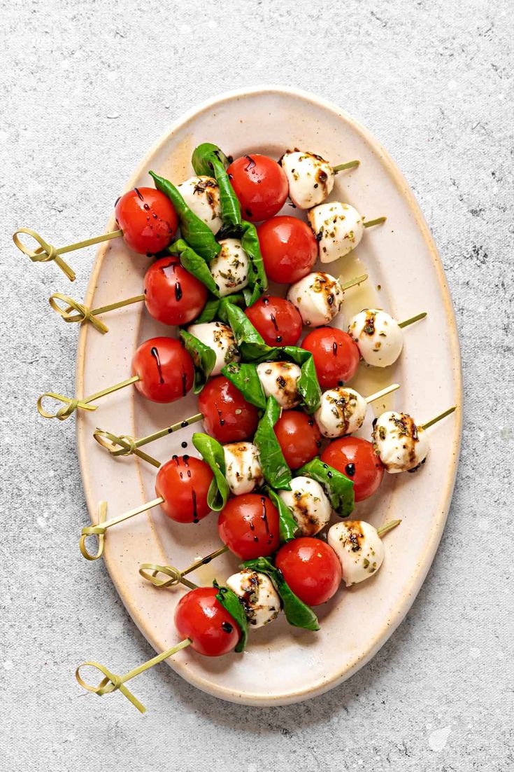 skewered cherry tomatoes and mozzarella on a plate