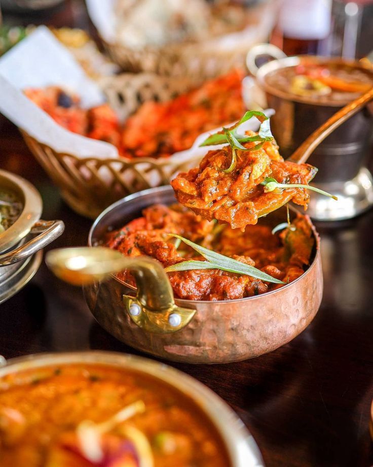 several bowls filled with food on top of a table