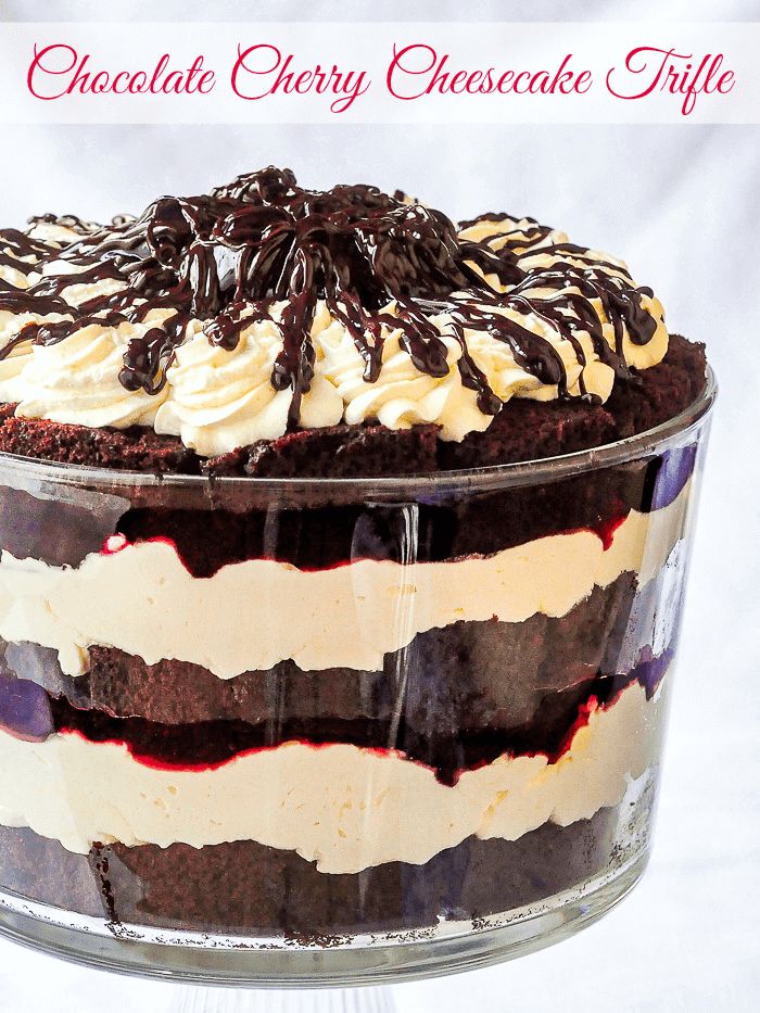 a chocolate cherry cheesecake cake in a glass dish