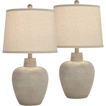 two white ceramic table lamps with beige shades