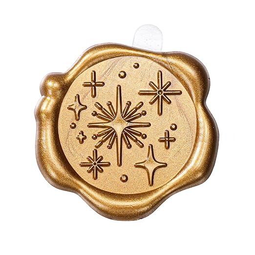 an image of a wax stamp with crosses and stars on it's surface in gold