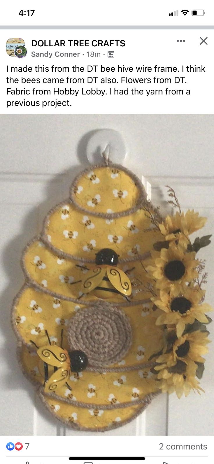 a sunflower wreath is hanging on the door