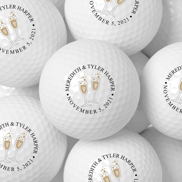 many white golf balls with champagne glasses on them and the names of their respective guests