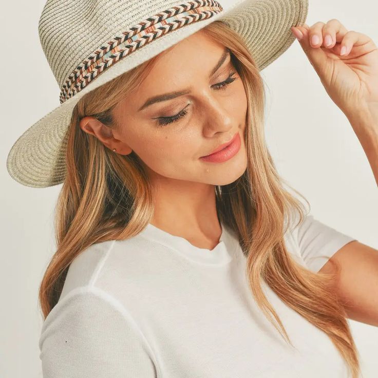 Add a touch of boho charm to your look with this stylish Straw Panama Fedora Hat! Quality crafted and accented with a Boho embroidered band, this hat is the perfect way to stay looking cool and on-trend. Plus, the suede tie accent gives it a unique touch! Material: 100% paper straw Circumference: 22" Brim length: 3.25" Straw Panama Hat, Lip Balm Holder, Wallet Organization, Judy Blue Jeans, Kids Hair Accessories, Tank Top Long Sleeve, Fedora Hat, Bottom Clothes, Hoodie Dress