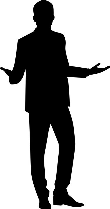 a black and white silhouette of a man in a suit with his hands out to the side