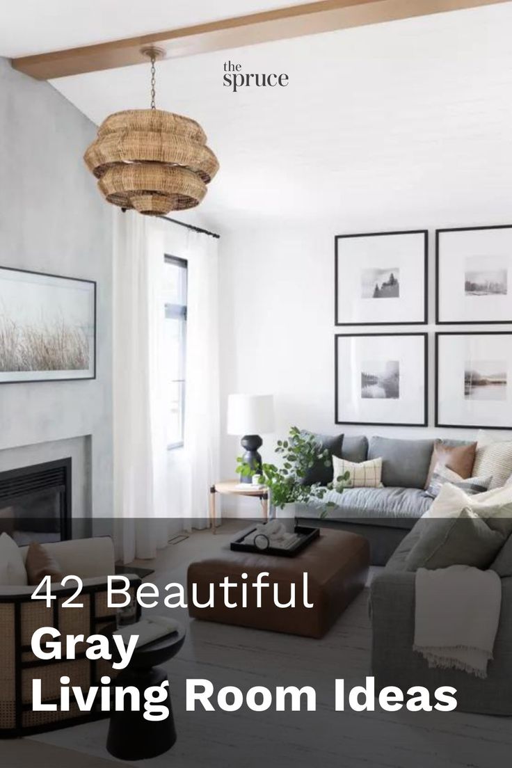 a living room with pictures on the wall and a chandelier hanging from the ceiling