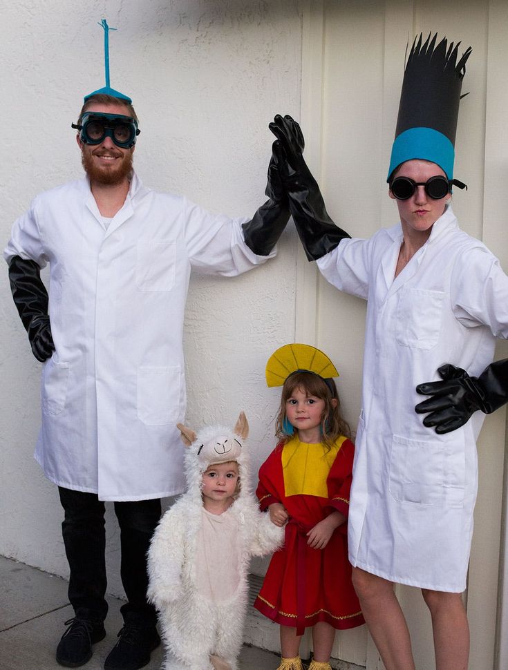 three people in costumes standing next to each other