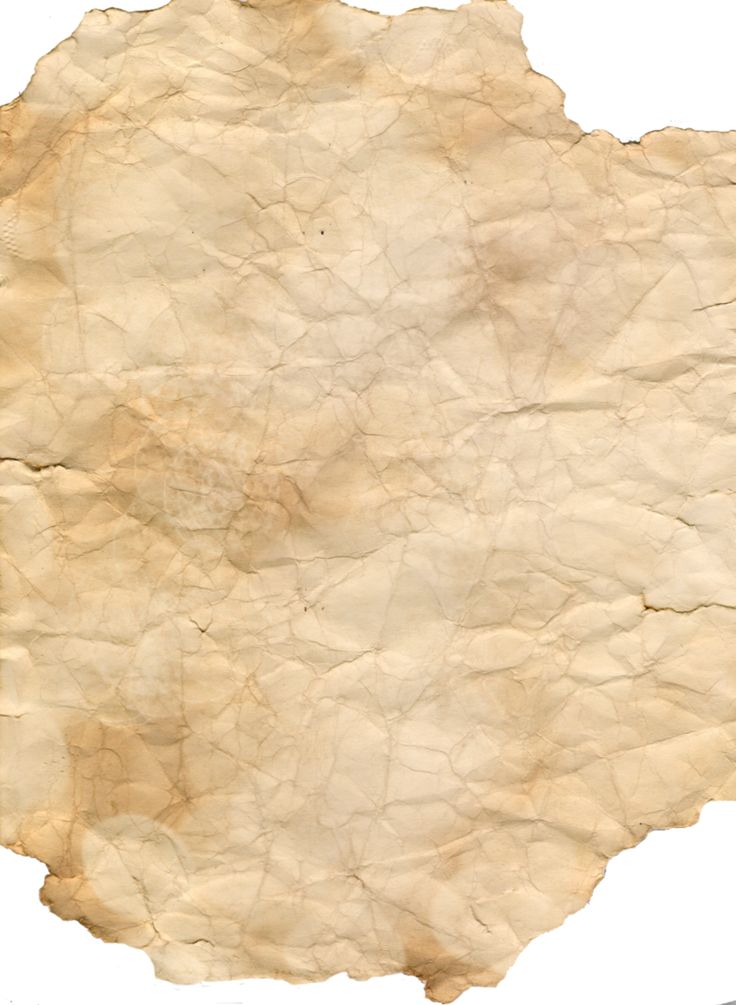 an old piece of paper that has been torn off and is sitting on a white surface