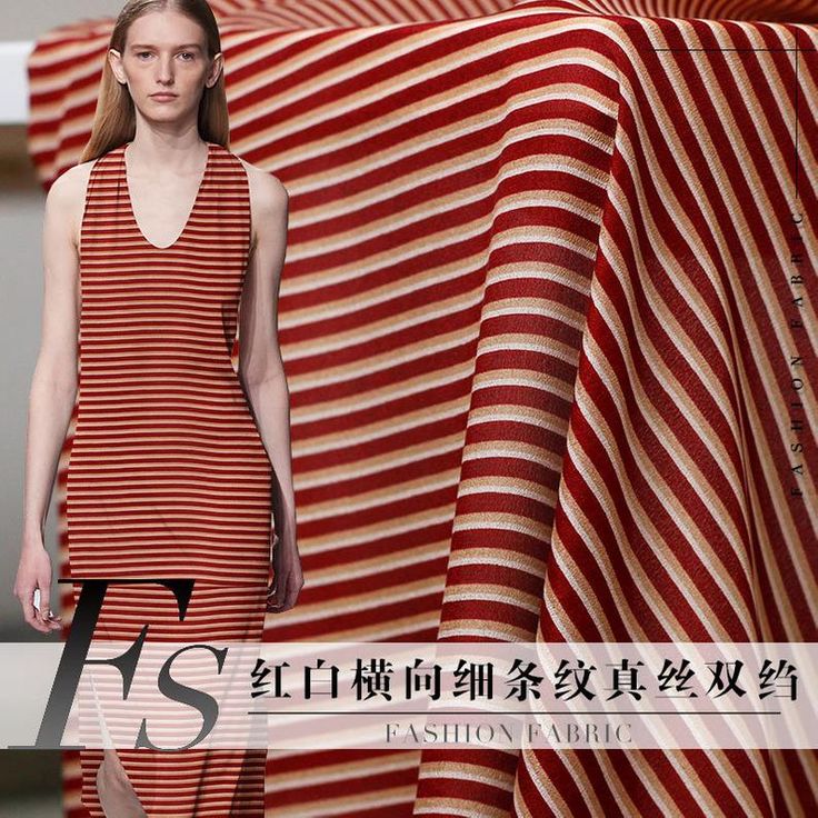 a woman in a red and white striped dress is walking down the runway with her hand on her hip