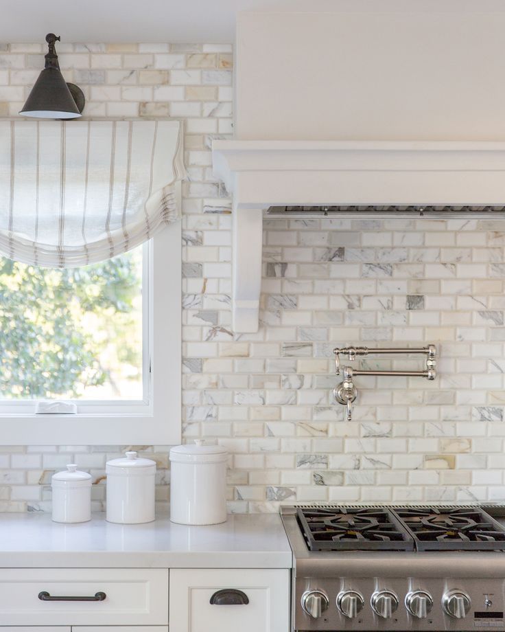 Daydreaming about this incredible marble subway tile in our MarinHillsideCottage kitchen. Photo