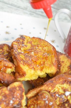 some french toast on a plate next to a cup