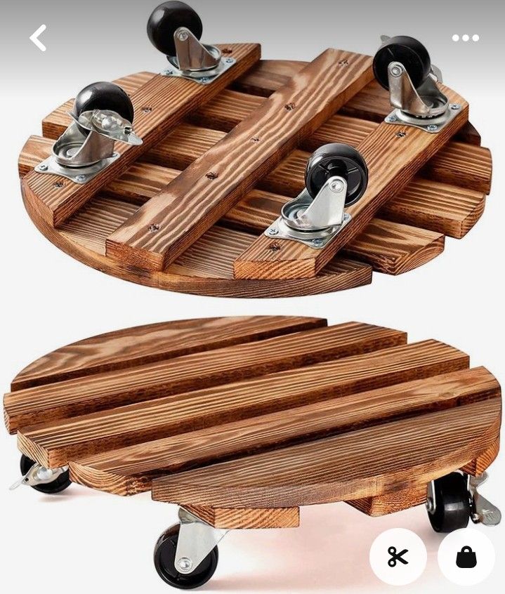 two wooden trays with wheels are shown on the same table as each one is made from wood