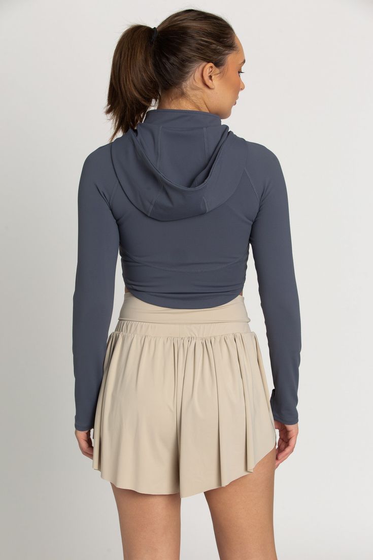 The perfect throw-on-and-go jacket is our Storm Athletic Hoodie Jacket. This piece features a classic hoodie style with thumb-hole finished sleeves. The material is a soft, stretch fabric that controls temperature and provides a cool, sporty look. Athletic Hoodie, Hoodie Style, Tennis Skirts, Athletic Top, Yoga Tops, Sporty Look, Thumb Holes, Athletic Shorts, Hoodie Jacket