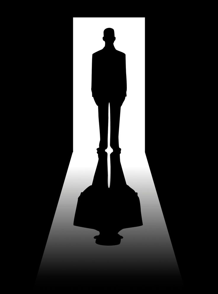 the silhouette of a man in a suit is shown through an open door with light coming from it