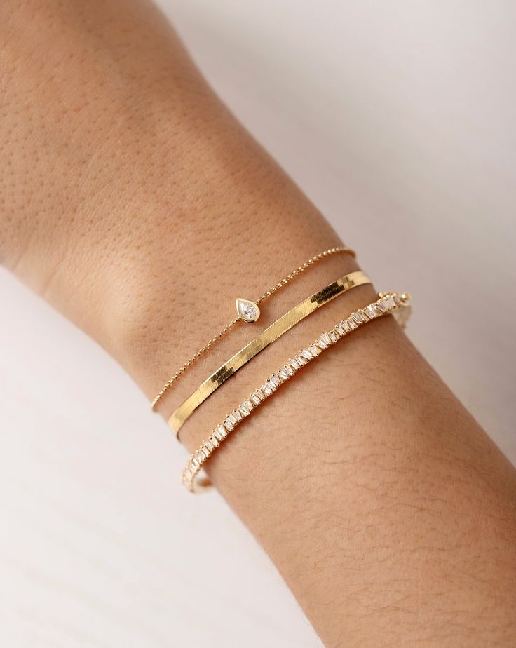 Why We Love It: Add a bit of edge to your stack with this unique bangle featuring offset baguette diamonds. The scattered angles of the setting ensure a luminous, light-catching statement. Dainty Bracelet Stack, Fine Bracelet, Gold Bracelets Stacked, Unique Bangle, Diamond Bangles, Necklace Length Guide, Bracelet Size Chart, Ring Concierge, Kids Rings