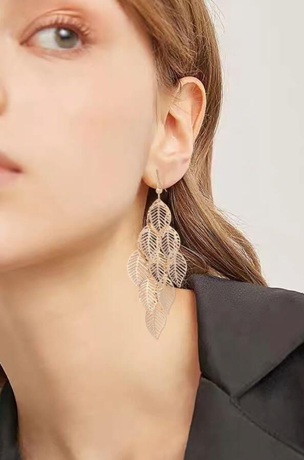 These exquisite earrings effortlessly blend timeless elegance with contemporary flair, making them an exceptional addition to your jewelry collection.Crafted with intricate attention to detail, these earrings feature a captivating multilayer hollow leaf design that dangles gracefully, creating a mesmerizing sense of movement with every step you take. The delicate filigree work showcases a level of craftsmanship reminiscent of bygone eras, adding a touch of nostalgia to your look.These earrings a Every Step You Take, Form Fitting Dress, Drops Design, Pet Hair, Leaf Design, Multi Layering, Deodorant, Timeless Elegance, Jewelry Collection