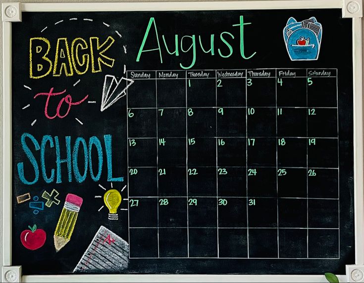 a chalk board with school supplies written on it