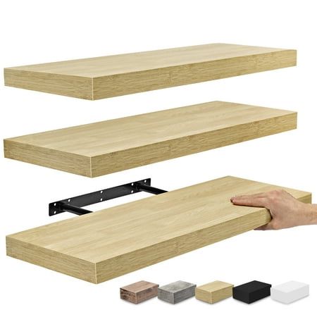 a hand is holding the edge of a shelf with several different colors and sizes on it