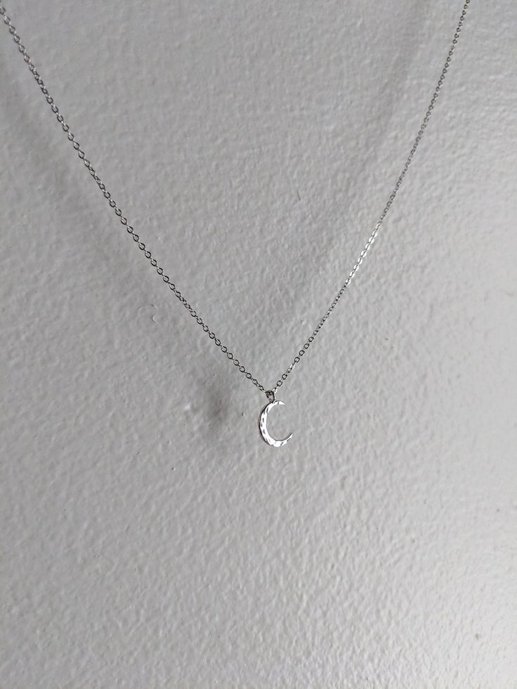 This is a delicate silver crescent moon pendant on a fine stainless steel chain. It comes in multiple lengths. It will never tarnish and is constructed from extremely high quality materials! Choose your preferred length at no extra cost! Thanks so much! Dainty Silver Moon Charm Necklaces, Dainty Silver Moon Charm Necklace, Silver Moon-shaped Clavicle Chain Charm Necklace, Silver Half Moon Charm Necklaces, Silver Dainty Moon Charm Necklace, Silver Moon Charm Necklace With Adjustable Chain, Silver Half Moon Charm Necklace, Silver Crescent Moon Phase Charm Necklace, Dainty Silver Necklace With Moon Charm