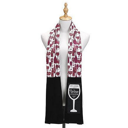 a white mannequin wearing a red and black scarf with wine glasses on it