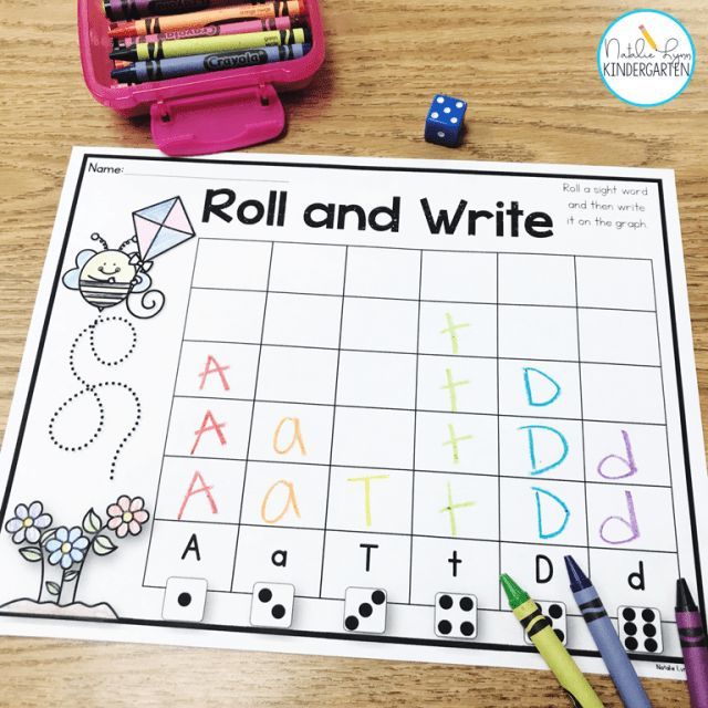 roll and write game with markers, pencils, and crayons on a table