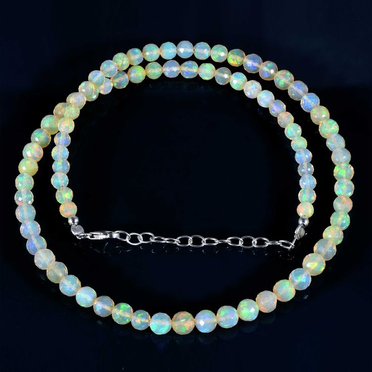 Ethiopian opal Shape- Round Faceted Size- 3.5-5.5 mm Length- 45 cm Metal- Sterling Silver 925 Ethiopian opal necklace-Round Faceted opal beads necklace-AAA Welo fire opal necklace-Beaded fire opal necklace -Natural Opal beads necklace All of my jewelry is designed and handcrafted by me. I love to experiment with many different designs and although I may make similar designs more than once, each piece of jewelry is truly one of a kind due to variations between gemstones and within my own craft wo Round Crystal Beaded Necklaces With Faceted Beads, Crystal Beaded Necklace With Faceted Round Beads, Crystal Faceted Beads Necklace, Silver Beaded Gemstones, Crystal Necklaces With Round Gemstone Beads, Faceted Crystal Beaded Necklaces, Crystal Necklaces For Jewelry Making With Round Beads, Single Strand Crystal Necklaces With Round Beads, Single Strand Crystal Necklace With Round Beads