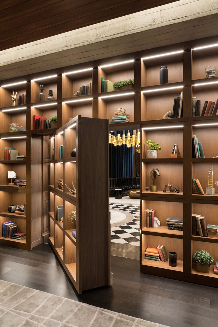 a room with many shelves filled with books