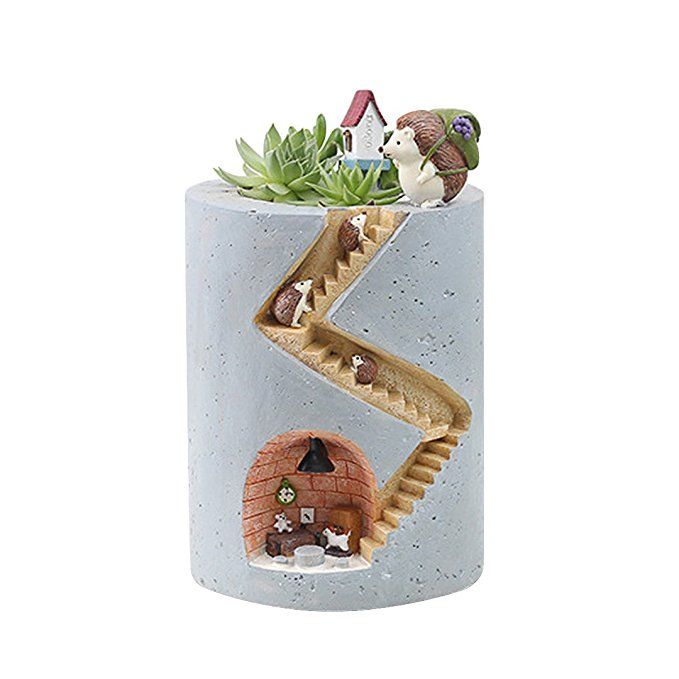 a snake in a cup with plants inside it and another animal on the bottom shelf